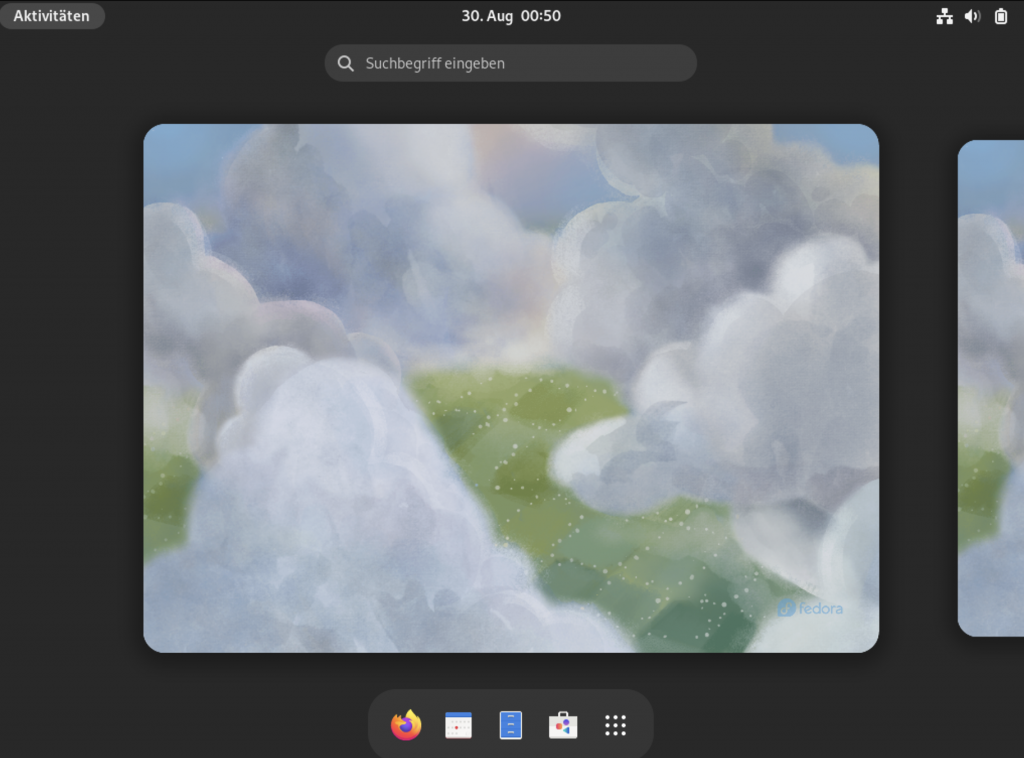Screenshot: GNOME-Desktop mit eingeblendetem Dock am unteren Bildschirmrand, oben ein Suchfeld.