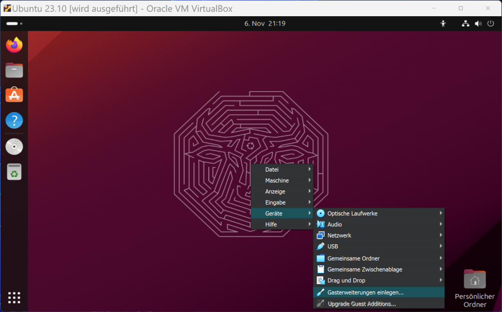 Der Ubuntu-Desktop in einer VM, eingeblendet ist ein Kontextmenü, ausgewählt ist "Geräte, Gasterweit^erungen einlegen".